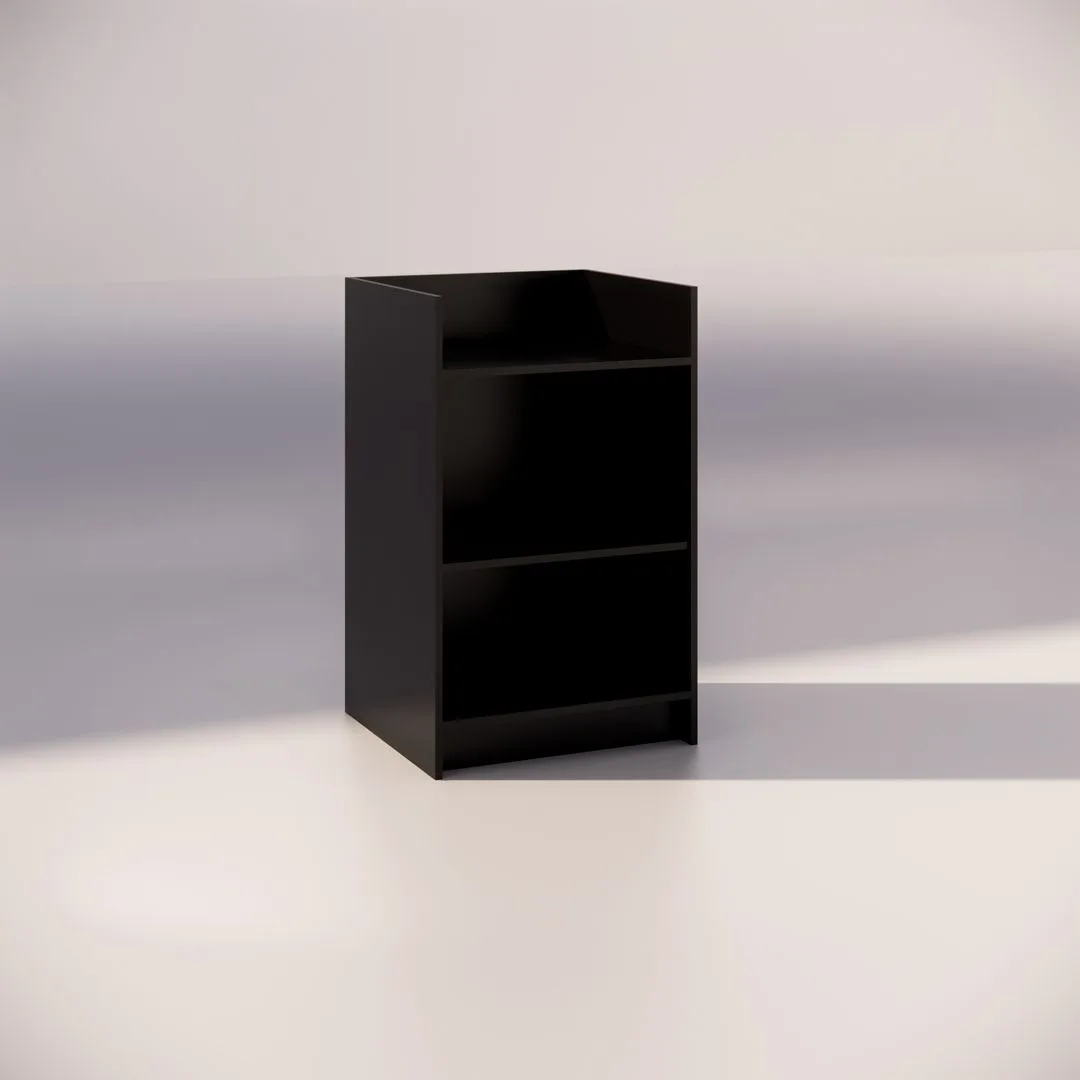 A minimalist black cabinet with two open shelves stands on a plain, light-colored background. The simple design and neutral setting suggest a focus on modern home or office storage.