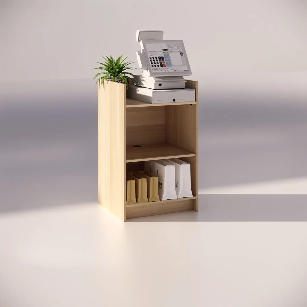 A Native Oak Timber Register Counter with a cash register on top is accompanied by a small plant. The shelves below store brown paper bags and a white bag, creating a retail or store ambiance, while the simple timber background enhances the minimalist design.